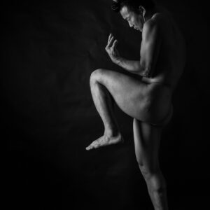 post tensioning - Vinny Miller standing nude in an athletic pose in the studio by The PhotoSmith